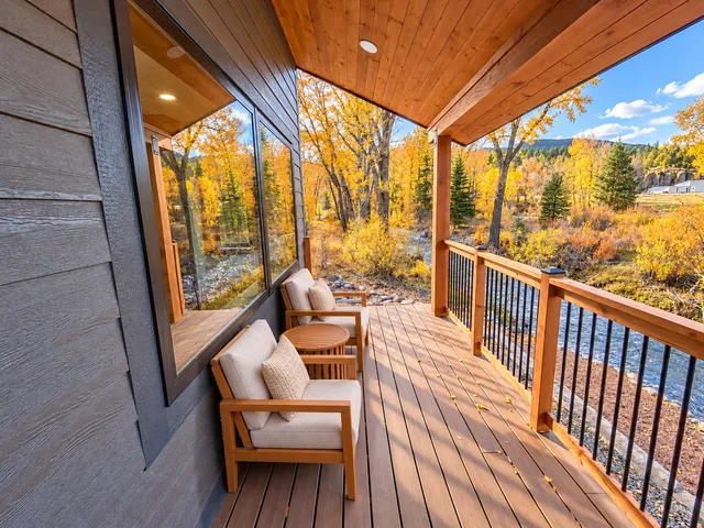Lounge chairs on the timber-covered deck overlooking the river
